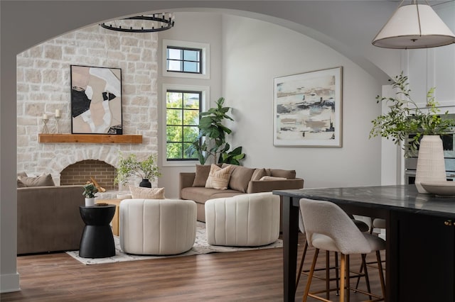 living room featuring a wealth of natural light and dark hardwood / wood-style flooring