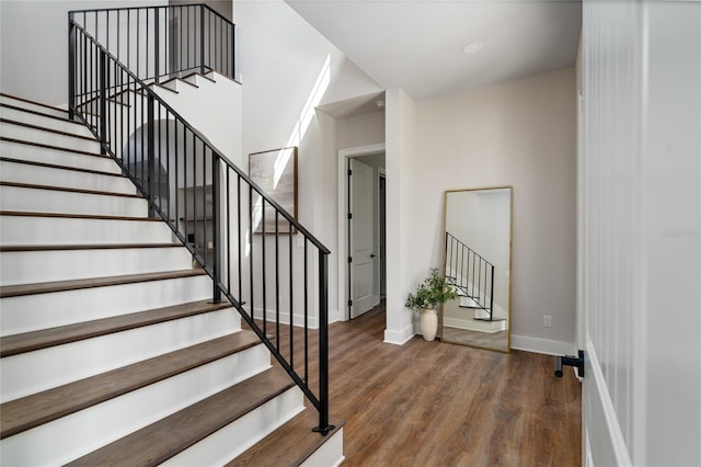 stairway featuring hardwood / wood-style floors