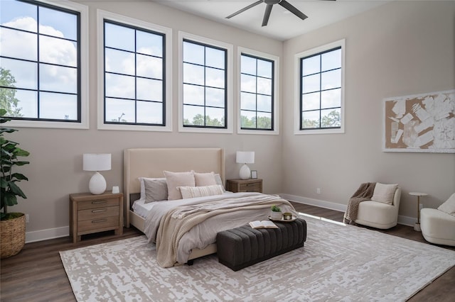 bedroom featuring dark hardwood / wood-style flooring and ceiling fan