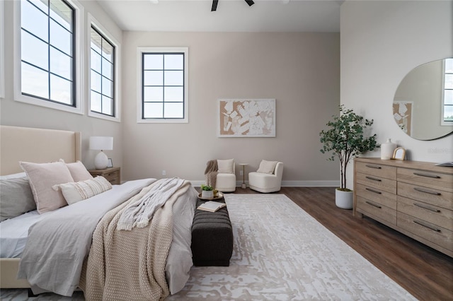 bedroom with dark hardwood / wood-style flooring