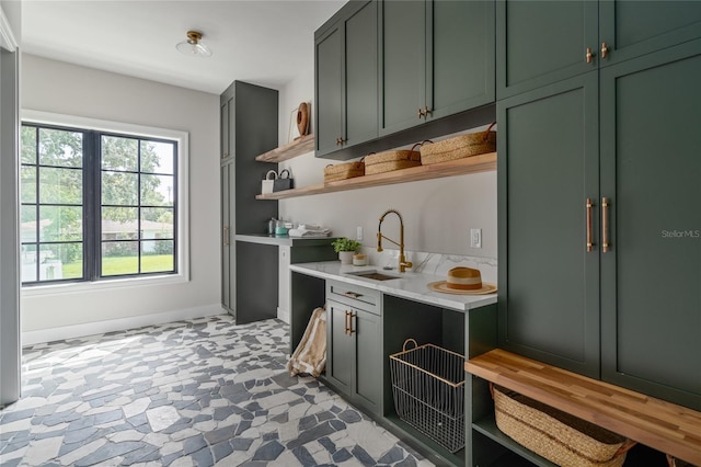 kitchen with sink and green cabinets