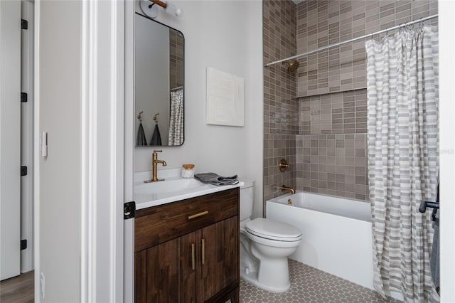 full bathroom with shower / tub combo with curtain, vanity, toilet, and tile patterned floors