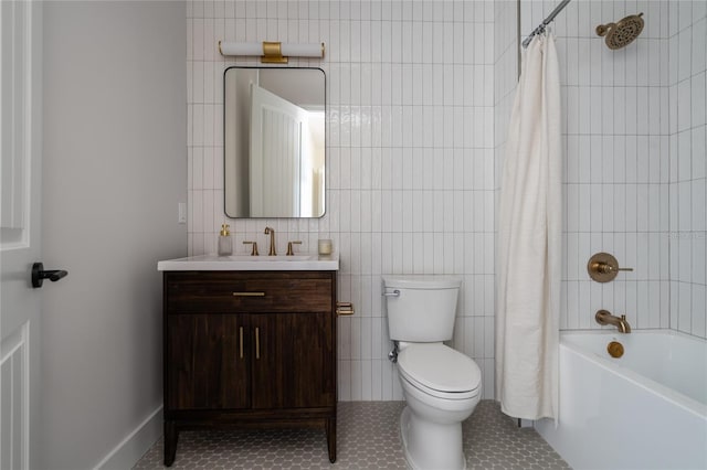 full bathroom with shower / bathtub combination with curtain, tile walls, vanity, tile patterned floors, and toilet