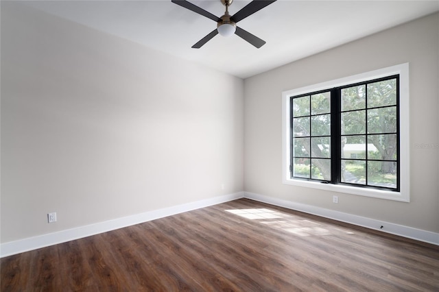 spare room with ceiling fan and wood-type flooring