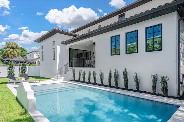 view of swimming pool with ceiling fan