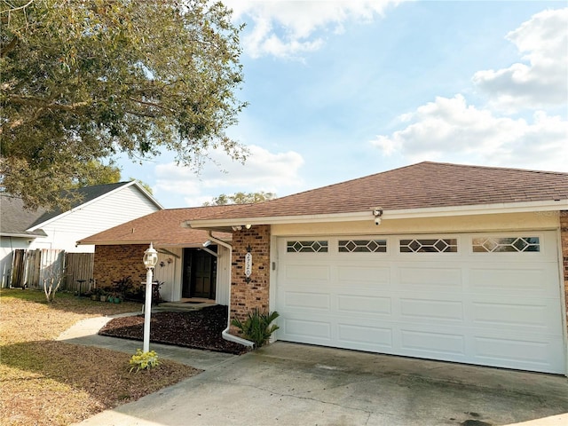 single story home with a garage