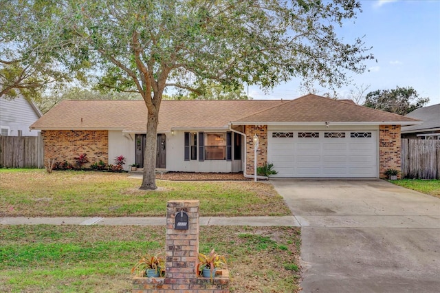 single story home with a garage and a front yard