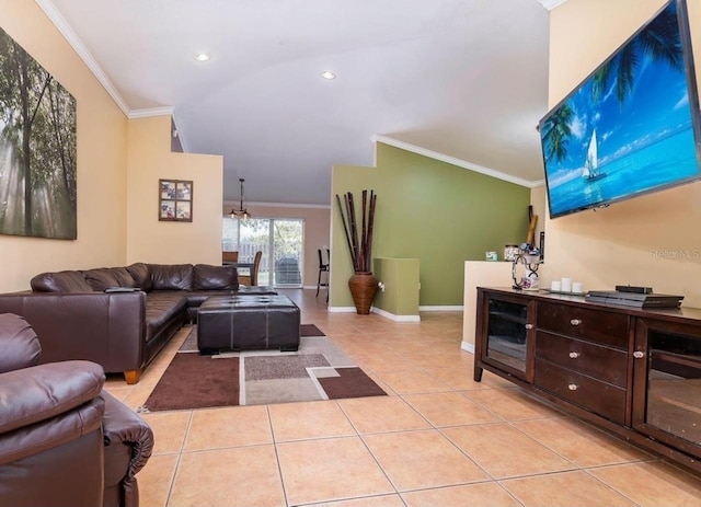 tiled living room featuring an inviting chandelier, ornamental molding, and vaulted ceiling