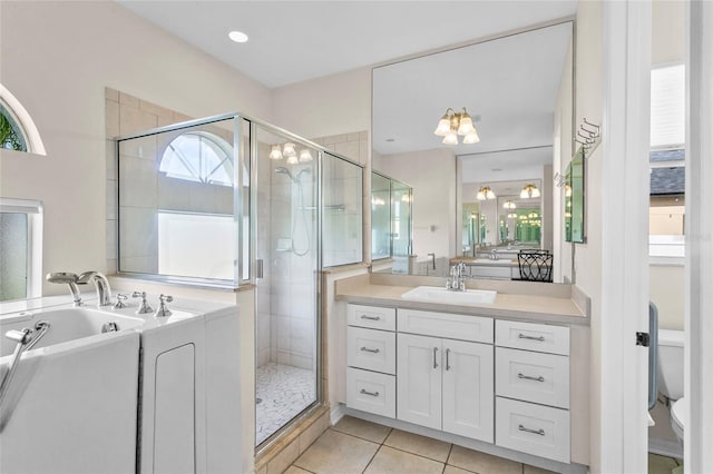 bathroom with vanity, an enclosed shower, tile patterned floors, and toilet