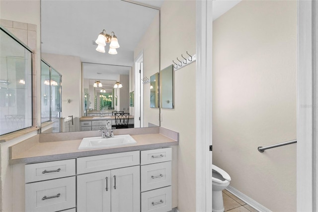 bathroom featuring vanity, tile patterned floors, a shower with door, and toilet