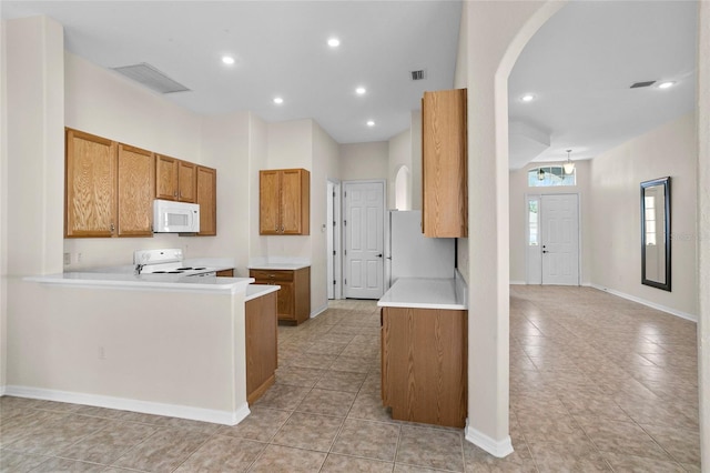 kitchen with white appliances and kitchen peninsula