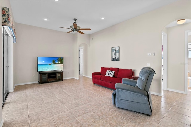 living room with light tile patterned floors and ceiling fan