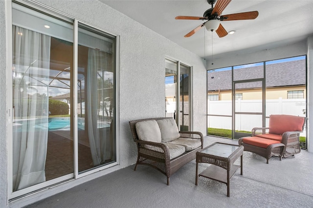 sunroom with ceiling fan