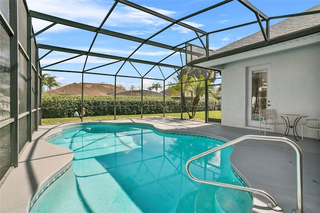 view of pool featuring a patio, a lanai, and a mountain view