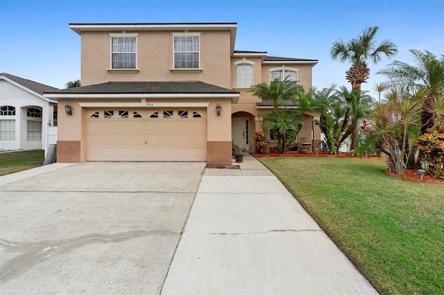 view of front property featuring a garage and a front lawn