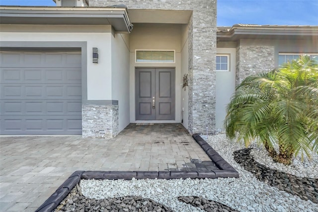 entrance to property featuring a garage