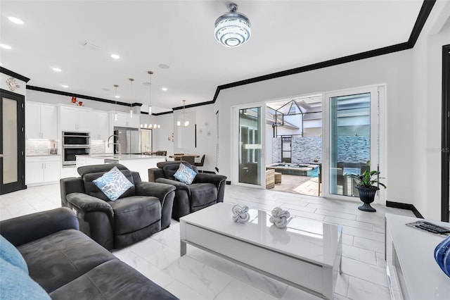 living room with crown molding and sink