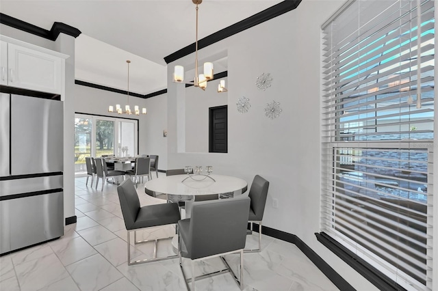 dining room featuring a high ceiling and a notable chandelier