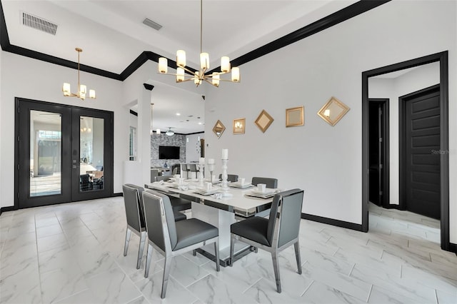 dining area with an inviting chandelier and french doors