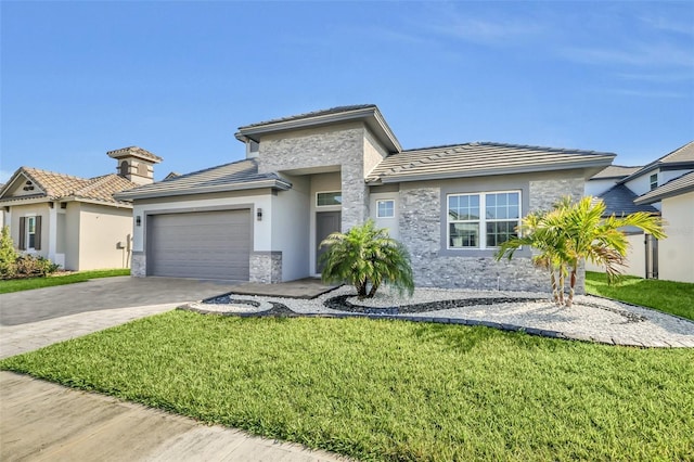 prairie-style home with a garage and a front lawn