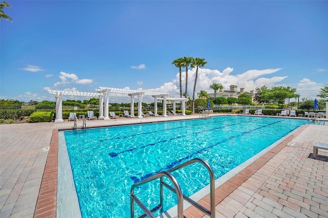 view of pool with a patio area and a pergola