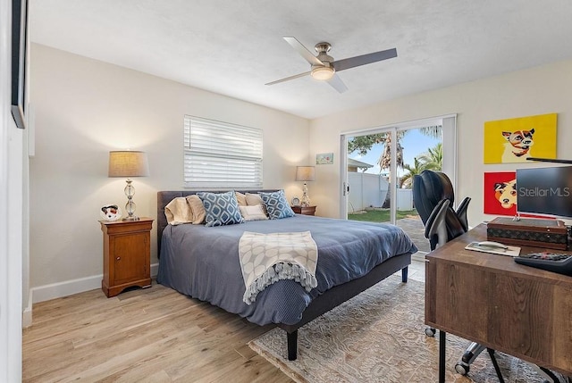 bedroom featuring access to outside, light hardwood / wood-style floors, and ceiling fan