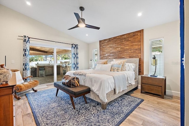 bedroom with ceiling fan, lofted ceiling, light hardwood / wood-style flooring, and access to outside