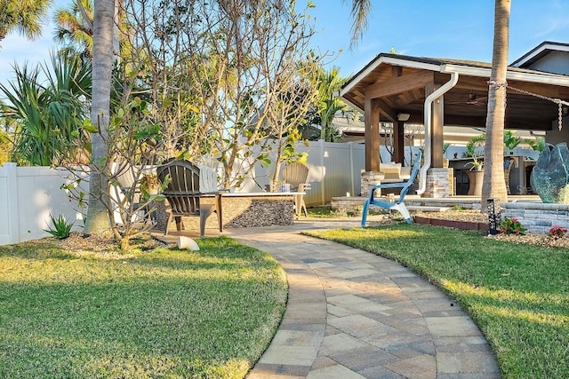 view of yard featuring a patio and ceiling fan