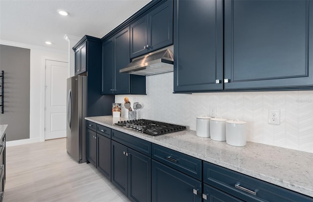 kitchen featuring decorative backsplash, stainless steel appliances, crown molding, light stone countertops, and blue cabinetry