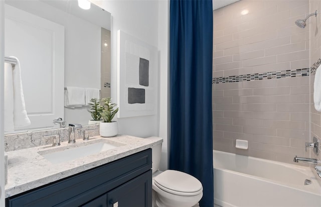 full bathroom with vanity, shower / bath combination with curtain, and toilet