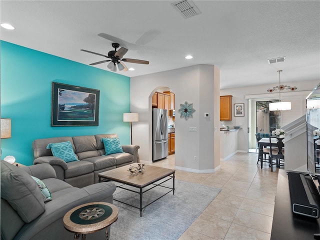 living room with light tile patterned flooring and ceiling fan