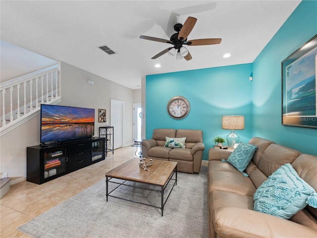 living room featuring ceiling fan and light tile patterned flooring