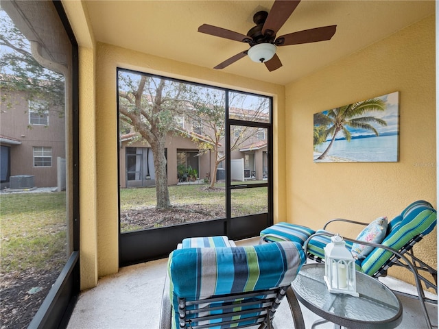 sunroom / solarium with ceiling fan