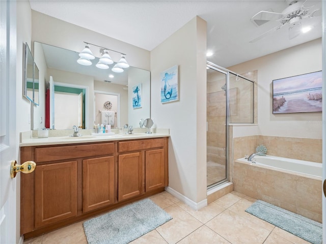 bathroom with ceiling fan, tile patterned floors, shower with separate bathtub, and vanity