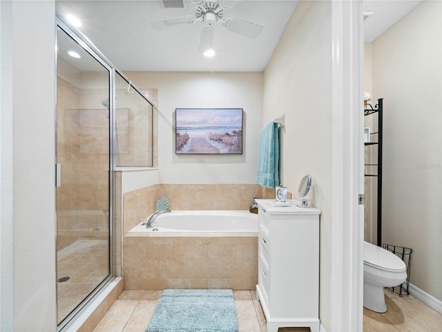 full bathroom with shower with separate bathtub, vanity, ceiling fan, toilet, and tile patterned floors