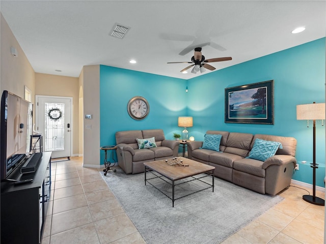 tiled living room featuring ceiling fan