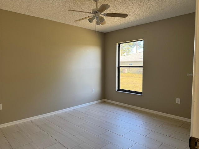 unfurnished room with a textured ceiling and ceiling fan