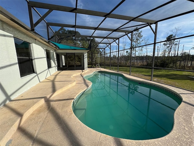 view of pool with a lanai and a patio area