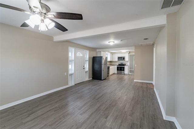 unfurnished living room with dark wood-type flooring and ceiling fan