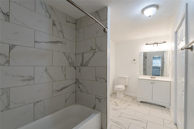 full bathroom with vanity, toilet, and tiled shower / bath combo