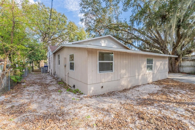 view of property exterior with central AC