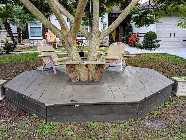 wooden terrace with a garage