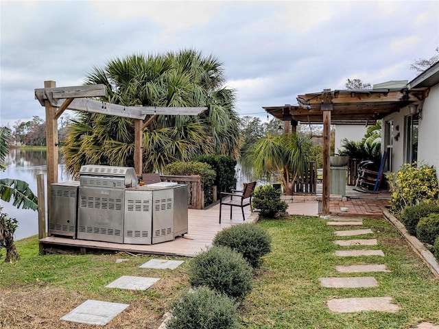 view of yard with a deck with water view