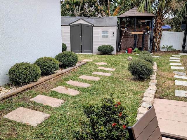 view of yard featuring a gazebo and a storage unit