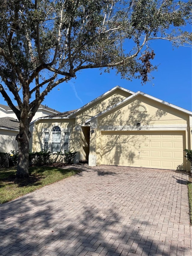 single story home with a garage