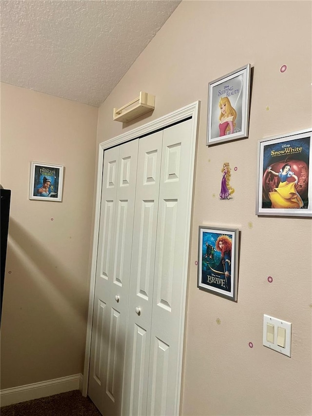 interior space featuring a textured ceiling