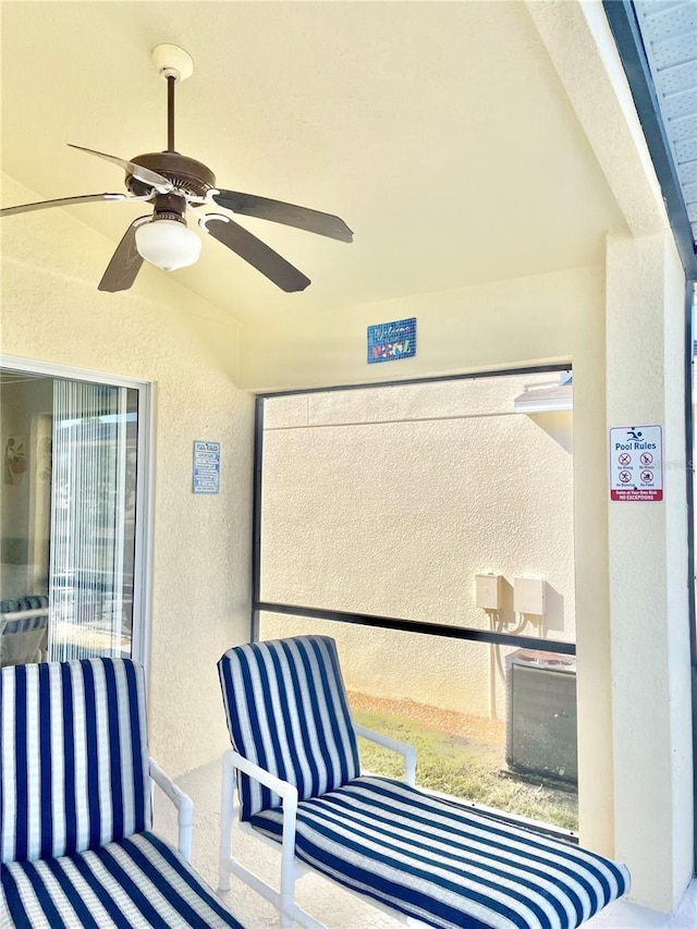 exterior space with ceiling fan