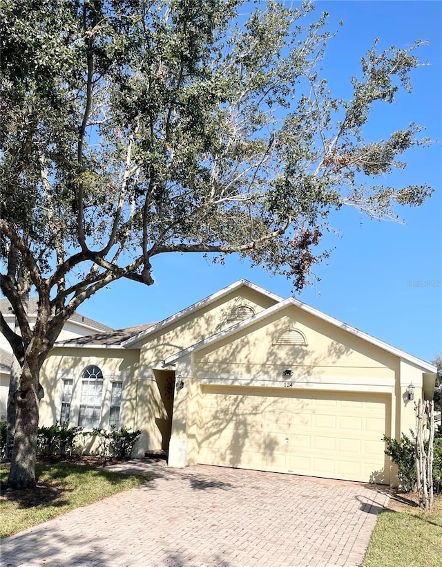 single story home featuring a garage