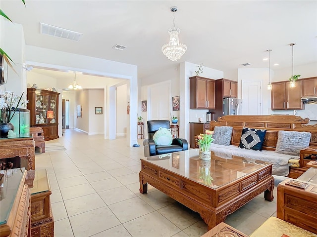 living room featuring light tile patterned floors and a notable chandelier