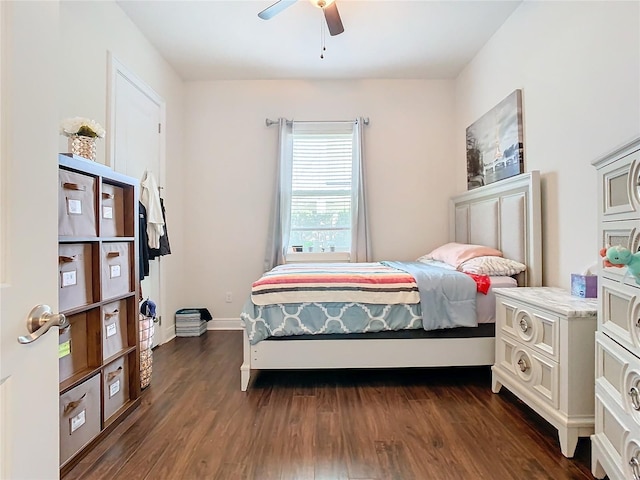 bedroom featuring ceiling fan and dark hardwood / wood-style flooring